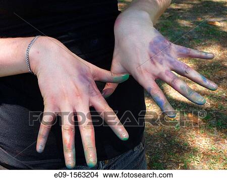 Picture - chalk-covered hands of art student at SCAD in Savannah, Georgia during sidewalk art festival. Fotosearch