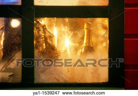 Stock Photo - Champagne bottle and Christmas tree illumination, Christmas market wooden house, Place St Louis, Metz, Lorraine region, France. Fotosearch