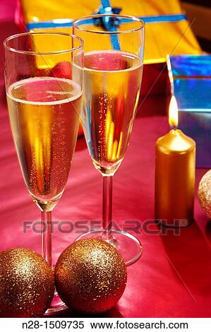 Champagne glasses and Christmas gifts View Large Photo Image Stock Photography - Champagne glasses and Christmas gifts. Fotosearch