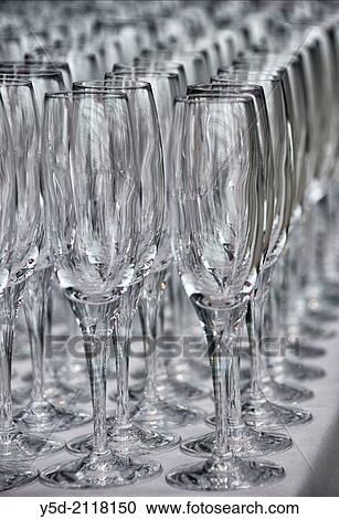 Stock Image - Champagne glasses ready for a big party. Fotosearch