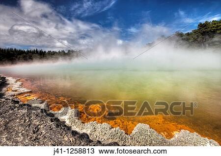 Champagne pool, burst of sunshine lights up foreshore during day of blowing mist and heavy rain, Wai-o-Tapu thermal region, Rotorua. View Large Photo Image Stock Image - Champagne pool, burst of sunshine lights up foreshore during day of blowing mist and heavy rain, Wai-o-Tapu thermal region, Rotorua.. Fotosearch