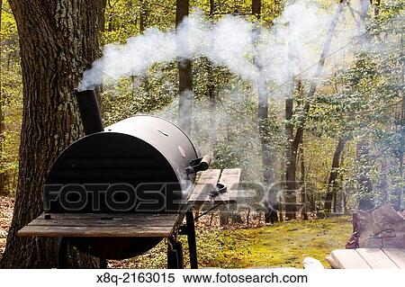 Charcoal barbecue grill/ smoker with smoke. View Large Photo Image Stock Photography - Charcoal barbecue grill/ smoker with smoke.. Fotosearch