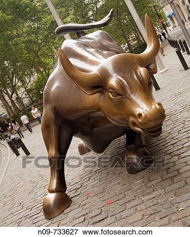 Charging Bull bronze sculpture near Wall Street, New York City, USA View Large Photo Image Stock Photo - Charging Bull bronze sculpture near Wall Street, New York City, USA. Fotosearch