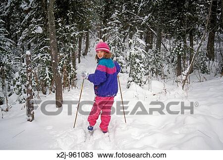 Charlevoix, Michigan - Mariel West, 9, cross-country skiing in the woods of northern Michigan MR View Large Photo Image Stock Image - Charlevoix, Michigan - Mariel West, 9, cross-country skiing in the woods of northern Michigan MR. Fotosearch