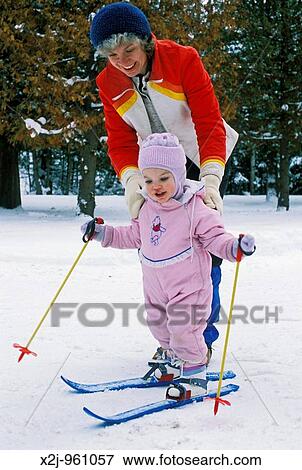 Charlevoix, Michigan - Mariel West, not quite 2, tries cross country skiing with the help of her mother, Susan Newell MR View Large Photo Image Stock Photo - Charlevoix, Michigan - Mariel West, not quite 2, tries cross country skiing with the help of her mother, Susan Newell MR. Fotosearch