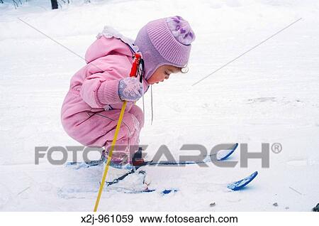 Stock Photo - Charlevoix, Michigan - Mariel West, not quite 2, tries cross-country skiing MR. Fotosearch