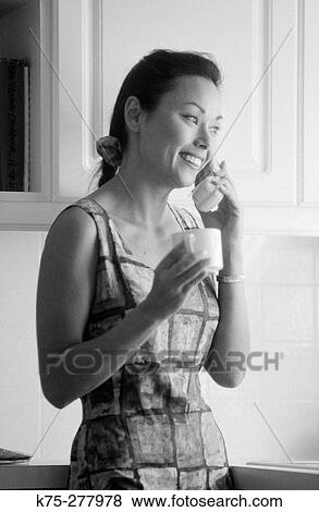 Stock Photo - chatting on the phone. Fotosearch