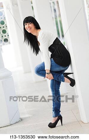 Stock Image - Cheerful young woman. Fotosearch
