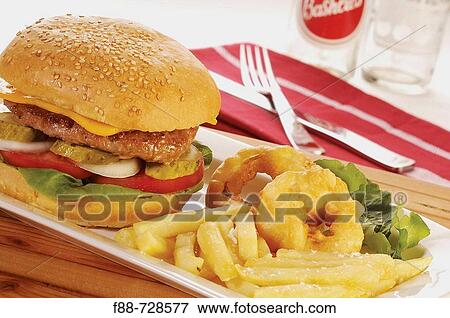 Stock Photo - Cheese burger and chips with fried onion rings, food. Fotosearch