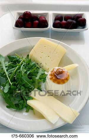 Cheeses with lemon jam, rocket and cherries. View Large Photo Image Stock Photograph - Cheeses with lemon jam, rocket and cherries.. Fotosearch
