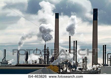 Chemical industry plants spew air pollution from Sarnia ontario canada on the united states border at port huron michigan along the st clair river View Large Photo Image Stock Photograph - Chemical industry plants spew air pollution from Sarnia ontario canada on the united states border at port huron michigan along the st clair river. Fotosearch