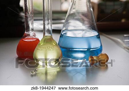 chemical laboratory flasks containing liquid shiny. View Large Photo Image Stock Photo - chemical laboratory flasks containing liquid shiny.. Fotosearch