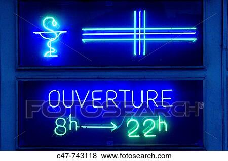 Stock Photo - Chemist sign, Paris, France. Fotosearch