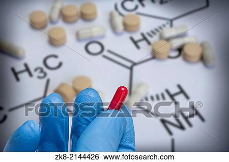 Stock Photograph - Chemistry science formula and tablets, Medicine symbol.. Fotosearch