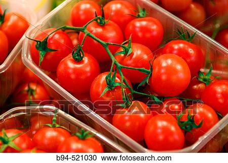 Stock Image - Cherry tomatoes at La Boquer? a market, Barcelona. Catalonia, Spain. Fotosearch