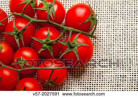 Stock Image - Cherry tomatoes. Close view.. Fotosearch