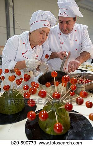 Stock Image - Cherry tomatoes, preparing canapes, Divinus Catering, San Sebastian, Donostia, Gipuzkoa, Basque Country. Fotosearch