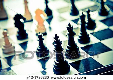 chessboard and chess pieces View Large Photo Image Stock Image - chessboard and chess pieces. Fotosearch