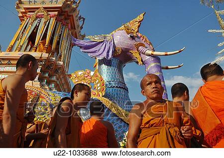 Chiang Mai (Thailand): monks at the Wat Phra Singh during another important monk's funeral, at the bottom of an elephant shaped pyre View Large Photo Image Stock Photo - Chiang Mai (Thailand): monks at the Wat Phra Singh during another important monk's funeral, at the bottom of an elephant shaped pyre. Fotosearch