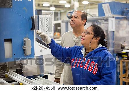 Chicago, Illinois - Members of the New Era Windows Cooperative assemble windows in their plant on Chicago's southwest side. View Large Photo Image Stock Photo - Chicago, Illinois - Members of the New Era Windows Cooperative assemble windows in their plant on Chicago's southwest side.. Fotosearch