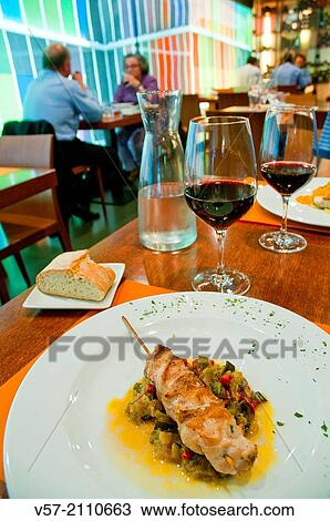 Chicken brochette with vegetables in a restaurant. Madrid, Spain. View Large Photo Image Stock Image - Chicken brochette with vegetables in a restaurant. Madrid, Spain.. Fotosearch