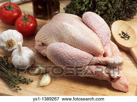 Chicken ready to be Cooked with Herbs, Tomatoes and Garlic View Large Photo Image Stock Photo - Chicken ready to be Cooked with Herbs, Tomatoes and Garlic. Fotosearch