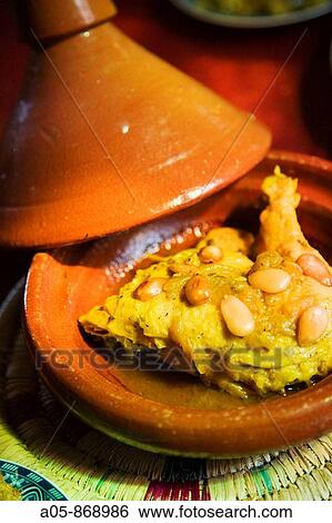 Chicken with almonds tajine at restaurant in the medina, Fes el Bali, Fes, Morocco View Large Photo Image Stock Photograph - Chicken with almonds tajine at restaurant in the medina, Fes el Bali, Fes, Morocco. Fotosearch