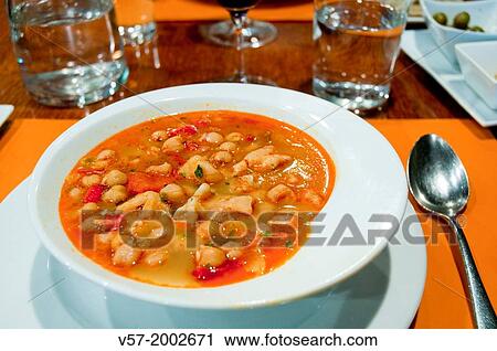 Stock Image - Chickpeas with cod and vegetables.. Fotosearch
