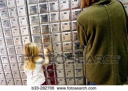 Child and adult opening mail boxes View Large Photo Image Stock Photograph - Child and adult opening mail boxes. Fotosearch