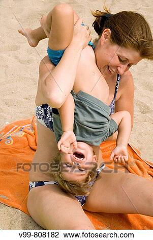 child and his mother play on the beach View Large Photo Image Stock Image - child and his mother play on the beach. Fotosearch