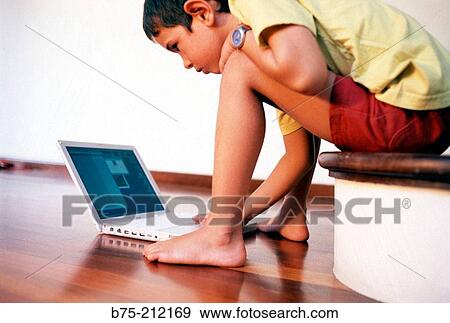 Child and laptop computer View Large Photo Image Stock Photo - Child and laptop computer. Fotosearch