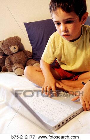 Child and laptop computer View Large Photo Image Stock Photo - Child and laptop computer. Fotosearch