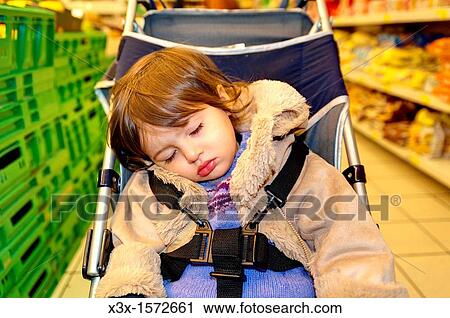 Child asleep in baby carriage View Large Photo Image Stock Image - Child asleep in baby carriage. Fotosearch