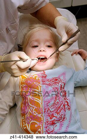 Child at dentist View Large Photo Image Stock Photo - Child at dentist. Fotosearch