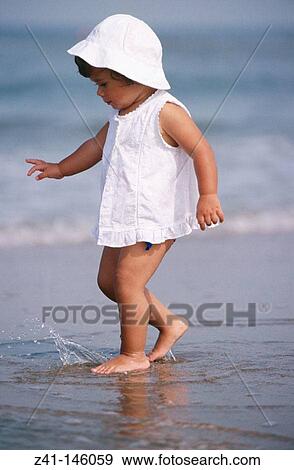 Child at the beach View Large Photo Image Stock Photo - Child at the beach. Fotosearch