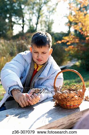 Child boy with nuts View Large Photo Image Stock Photo - Child boy with nuts. Fotosearch