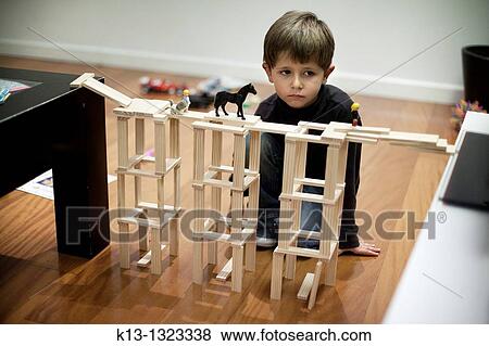 Child building a bridge toy View Large Photo Image Stock Photo - Child building a bridge toy. Fotosearch