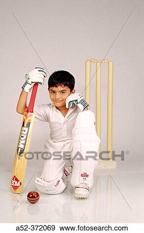 Child dressed as cricketer View Large Photo Image Stock Photo - Child dressed as cricketer. Fotosearch
