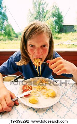 Child eating spagetti View Large Photo Image Stock Image - Child eating spagetti. Fotosearch
