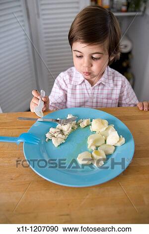 Child eating. View Large Photo Image Stock Image - Child eating.. Fotosearch