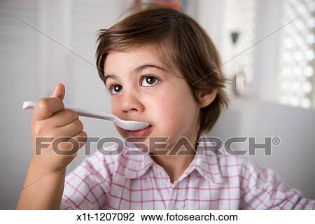 Child eating. View Large Photo Image Stock Image - Child eating.. Fotosearch