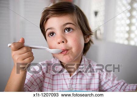 Child eating. View Large Photo Image Stock Image - Child eating.. Fotosearch