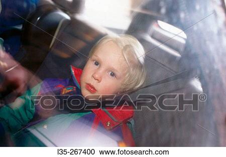 Child in a car with the safety belt View Large Photo Image Stock Image - Child in a car with the safety belt. Fotosearch