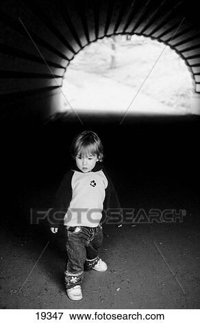 Stock Photo - Child in a tunnel. Fotosearch