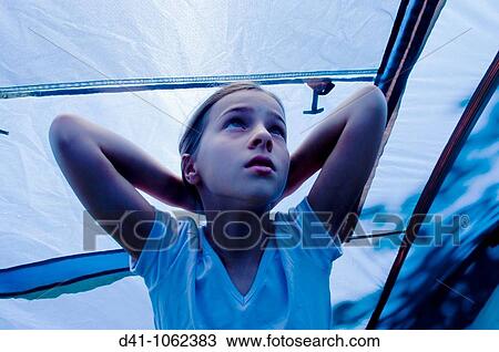 Stock Image - Child in blue tent. Fotosearch