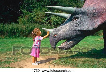 Child in dinosaur park View Large Photo Image Stock Image - Child in dinosaur park. Fotosearch