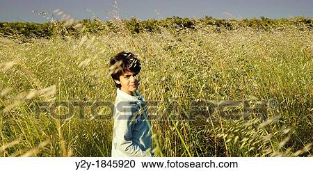 Stock Image - Child in the field.. Fotosearch