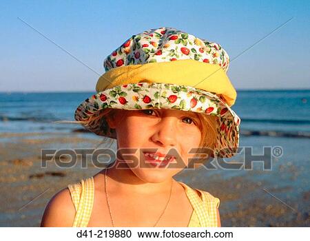 Child in yellow hat View Large Photo Image Stock Image - Child in yellow hat. Fotosearch