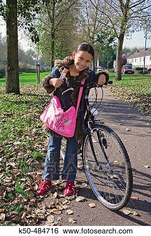 Child just coming out of school View Large Photo Image Stock Photograph - Child just coming out of school. Fotosearch