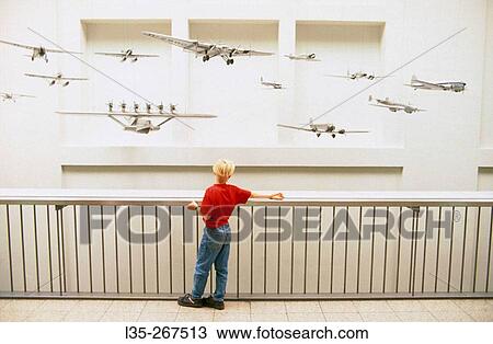 Child looking at hanging planes. Deutches museum. Munich. Germany View Large Photo Image Stock Image - Child looking at hanging planes. Deutches museum. Munich. Germany. Fotosearch